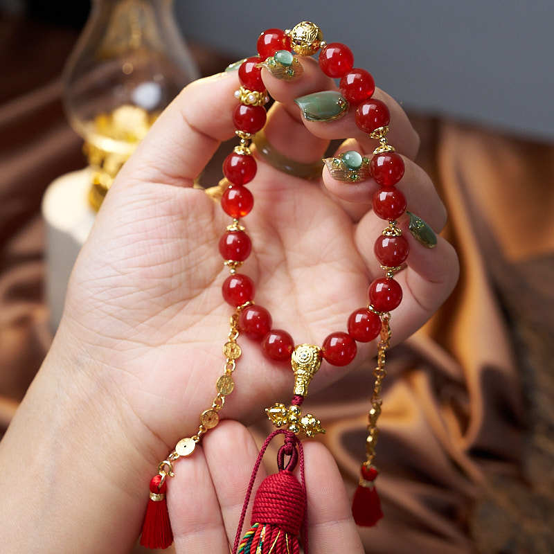 Handmade Tibetan Bracelet featuring 18 natural Red Agate Beads for courage & vitality, with antique coin charm for prosperity